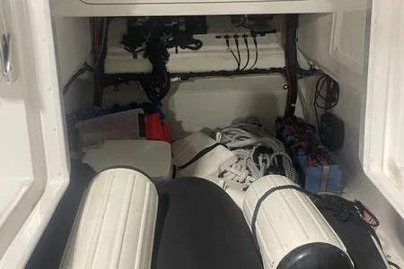  Yacht Photos Pics Storage compartment of a 2022 Prowler 31 boat with ropes and equipment.