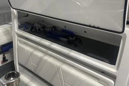 Yacht Photos Pics 2022 Prowler 31 boat interior storage compartment with open lid and visible equipment.