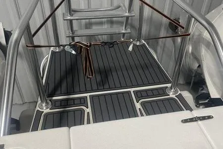  Yacht Photos Pics 2022 Prowler 31 boat deck with stainless steel railings and non-slip flooring.