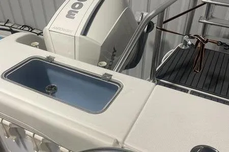  Yacht Photos Pics 2022 Prowler 31 boat with motor and deck details in a storage area.