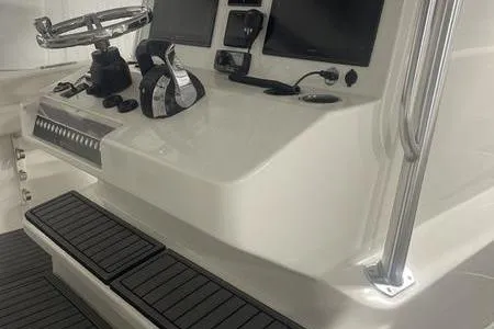  Yacht Photos Pics 2022 Prowler 31 boat console with steering wheel, controls, and electronic displays.