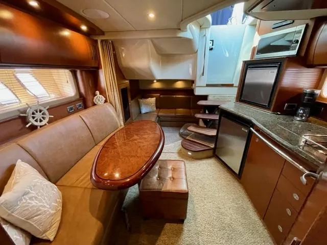 "jimi Thing Iv" Yacht Photos Pics Luxurious interior of a 2007 Sea Ray 38 Sundancer yacht with elegant wood finishes.