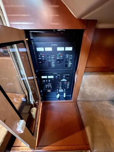 "jimi Thing Iv" Yacht Photos Pics Electrical panel inside 2007 Sea Ray 38 Sundancer yacht, featuring control switches and indicators.