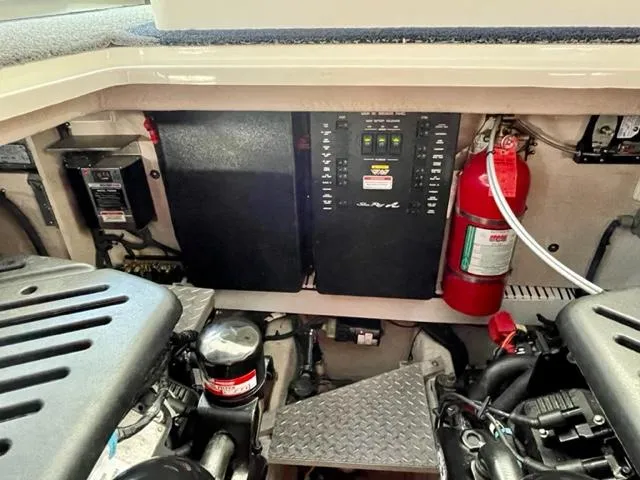 "jimi Thing Iv" Yacht Photos Pics Engine compartment of a 2007 Sea Ray 38 Sundancer with control panels and fire extinguisher.