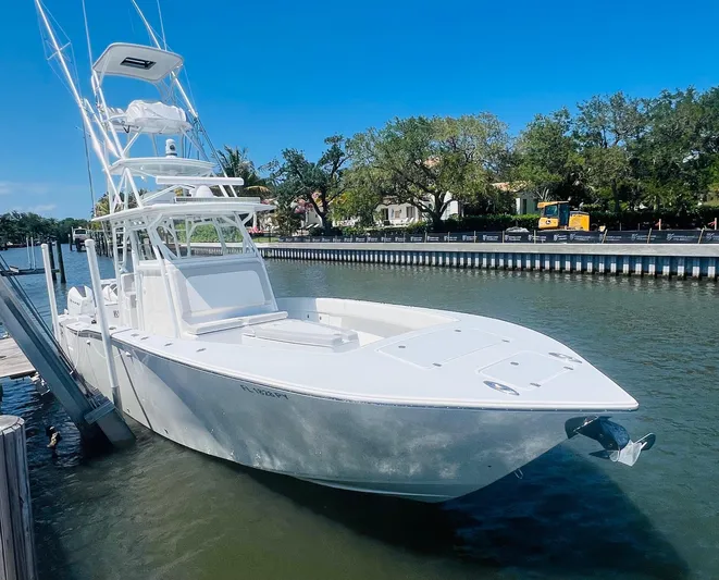  Yacht Photos Pics 2015 Billfish 39 Custom CC boat docked by a riverside.