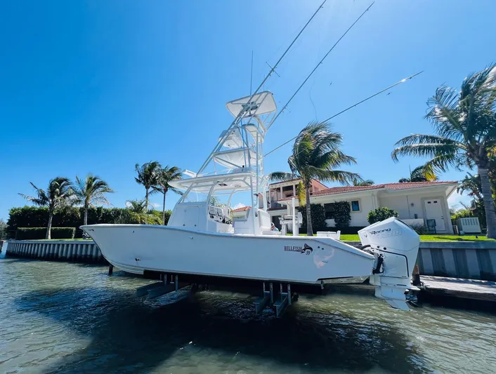 Yacht Photos Pics 2015 Billfish 39 Custom CC boat docked near waterfront homes.