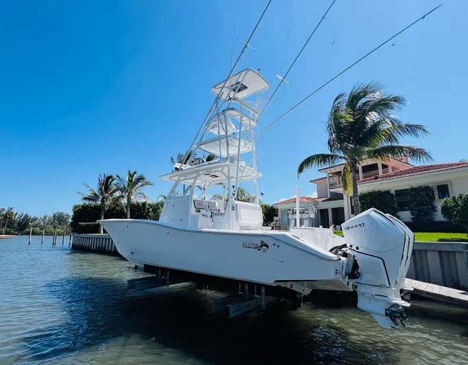  Yacht Photos Pics 2015 Billfish 39 Custom CC boat docked near waterfront home.