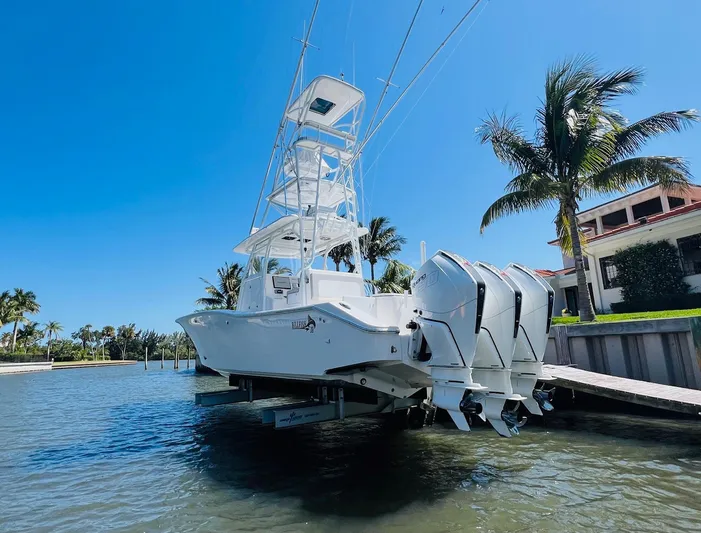  Yacht Photos Pics 2015 Billfish 39 Custom CC boat docked by a waterfront property.