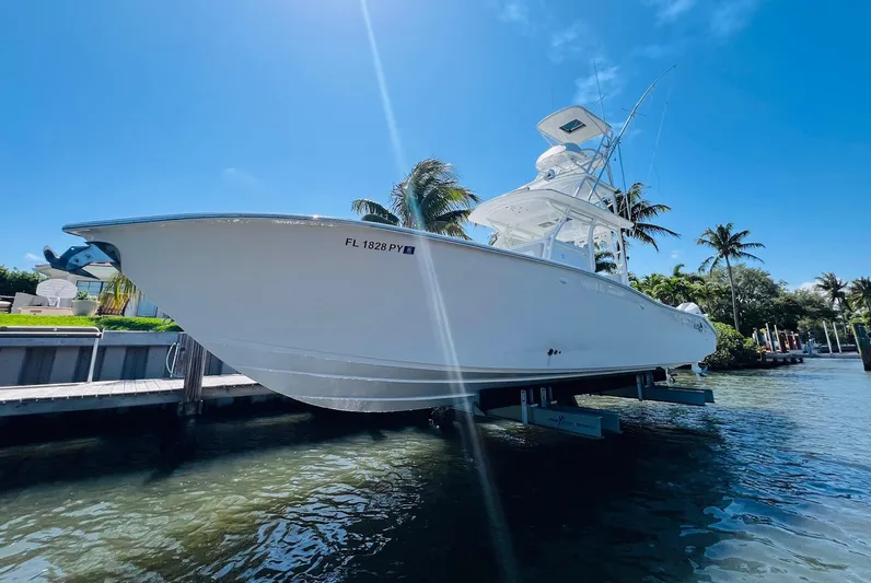  Yacht Photos Pics 2015 Billfish 39 Custom CC boat docked by the water on a sunny day.