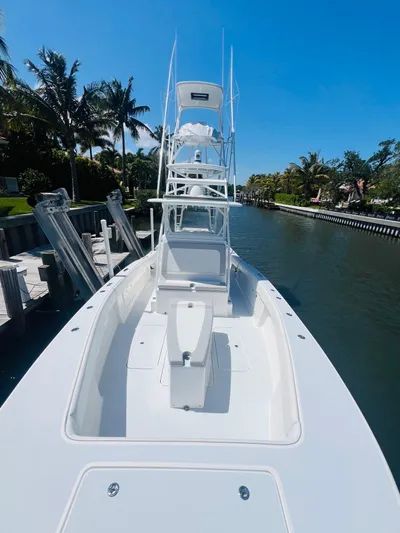  Yacht Photos Pics 2015 Billfish 39 Custom CC boat docked in a sunny canal.