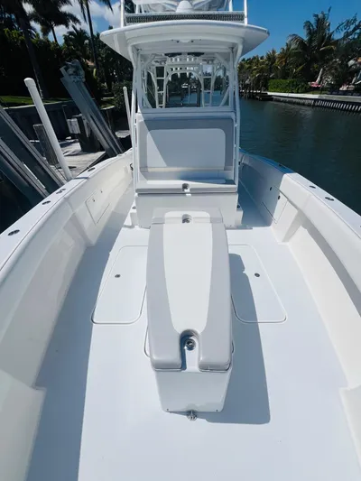 Yacht Photos Pics 2015 Billfish 39 Custom CC boat, spacious deck, sleek design, docked by the water.