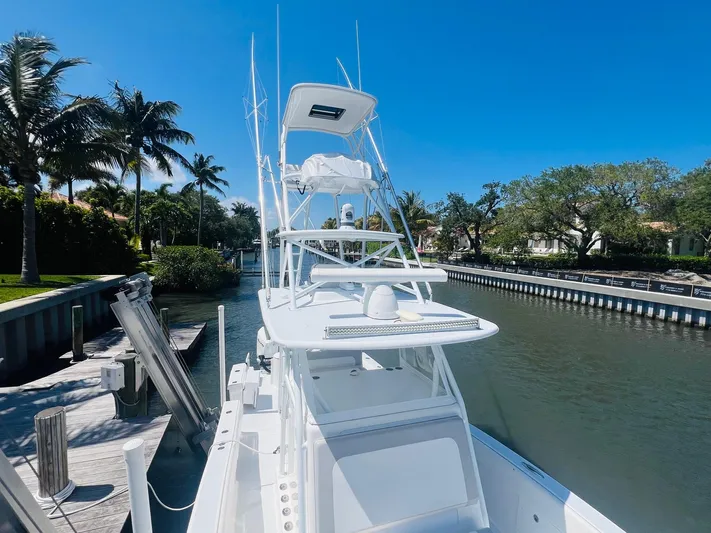  Yacht Photos Pics 2015 Billfish 39 Custom CC boat docked in a sunny canal.