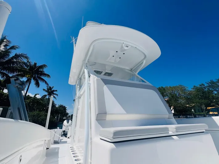  Yacht Photos Pics 2015 Billfish 39 Custom CC boat under clear blue sky with palm trees.