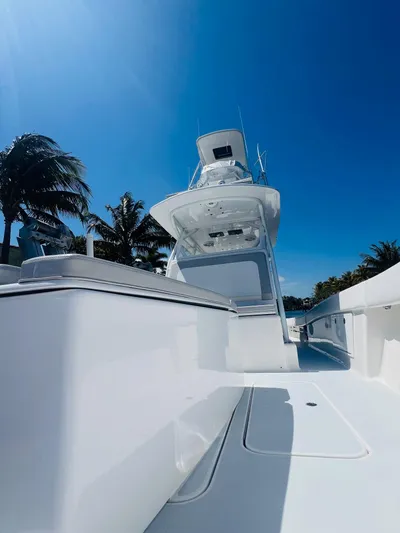  Yacht Photos Pics 2015 Billfish 39 Custom CC boat with clear blue sky and palm trees.