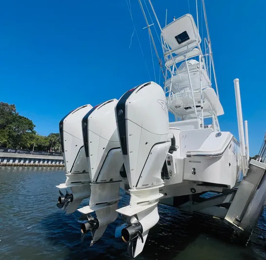  Yacht Photos Pics 2015 Billfish 39 Custom CC with triple outboard engines on water.