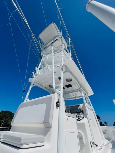  Yacht Photos Pics 2015 Billfish 39 Custom CC boat with tower against clear blue sky.