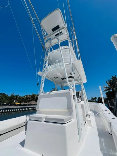  Yacht Photos Pics 2015 Billfish 39 Custom CC boat with tower against a clear blue sky.