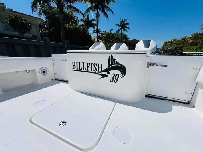  Yacht Photos Pics 2015 Billfish 39 Custom CC boat deck with logo, palm trees in background.