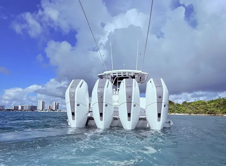  Yacht Photos Pics 2024 Scout 400 LXF boat with four powerful outboard engines on the water.