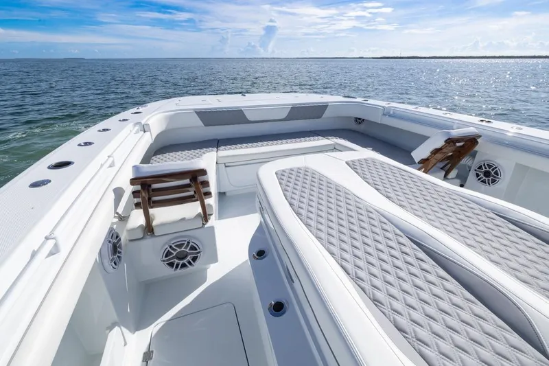  Yacht Photos Pics Luxurious 2026 Invincible 46 Catamaran with spacious deck and comfortable seating on open water.