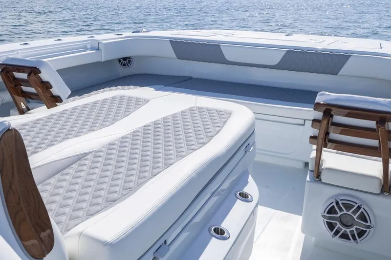  Yacht Photos Pics Luxurious seating on 2026 Invincible 46 Catamaran with quilted upholstery and ocean backdrop.
