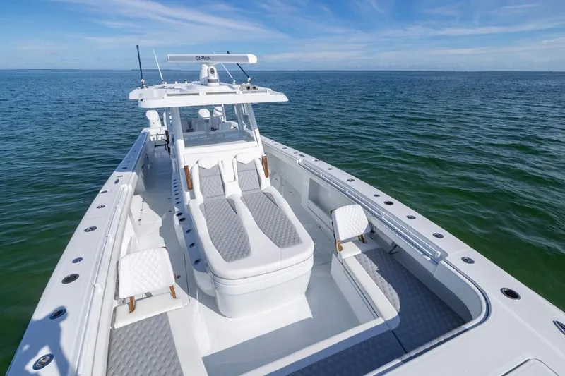  Yacht Photos Pics 2026 Invincible 46 Catamaran on open water, showcasing sleek design and spacious deck.