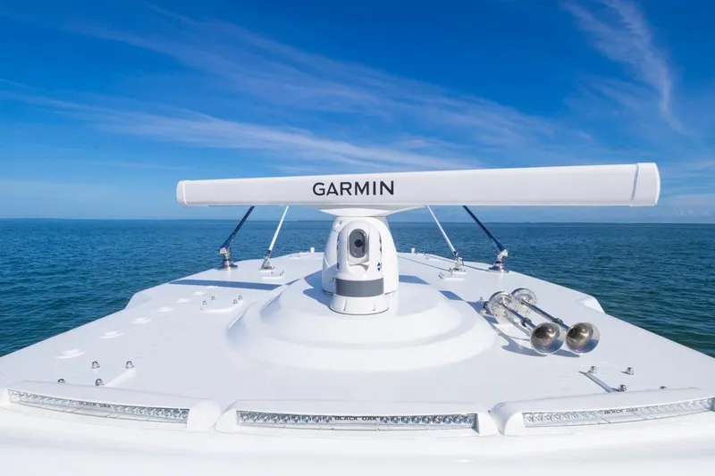  Yacht Photos Pics 2026 Invincible 46 Catamaran with Garmin radar on open sea under clear blue sky.