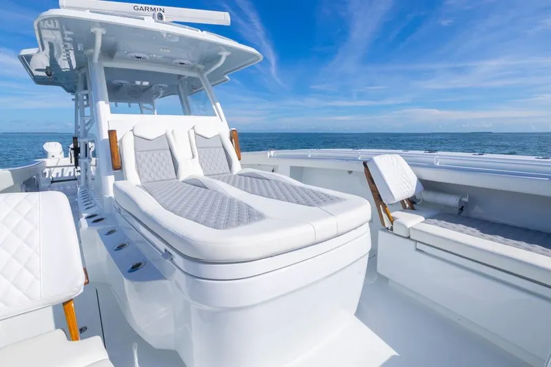  Yacht Photos Pics Luxurious 2026 Invincible 46 Catamaran with plush seating on open ocean.