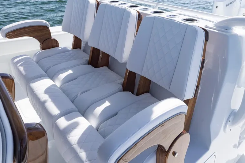  Yacht Photos Pics Luxurious seating on 2026 Invincible 46 Catamaran with quilted white upholstery.