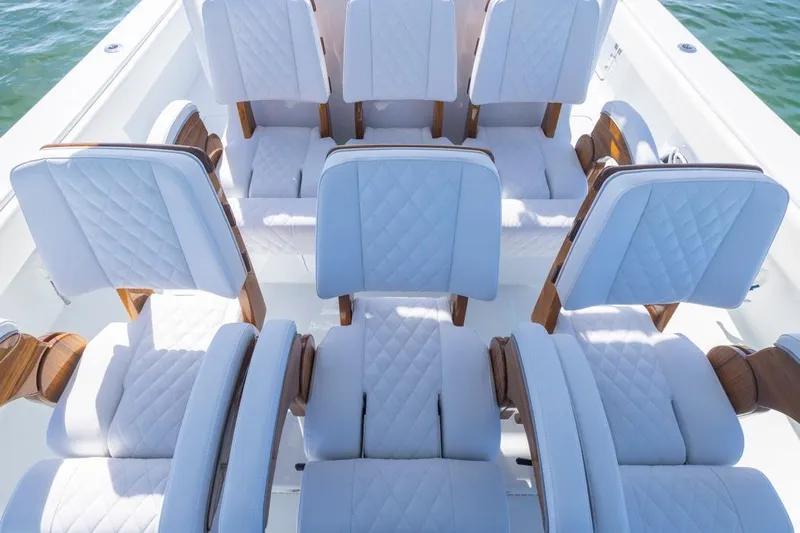  Yacht Photos Pics Luxurious seating on 2026 Invincible 46 Catamaran, featuring elegant white upholstery.