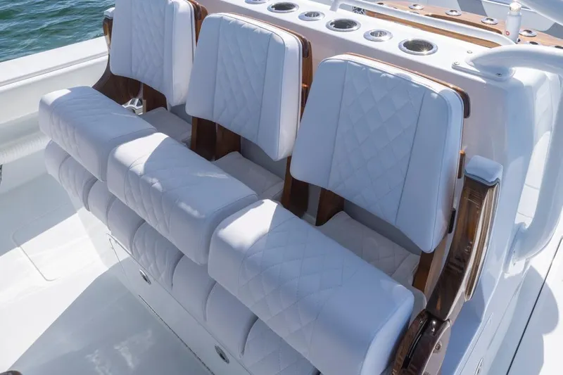  Yacht Photos Pics Luxurious seating on 2026 Invincible 46 Catamaran with quilted white upholstery.