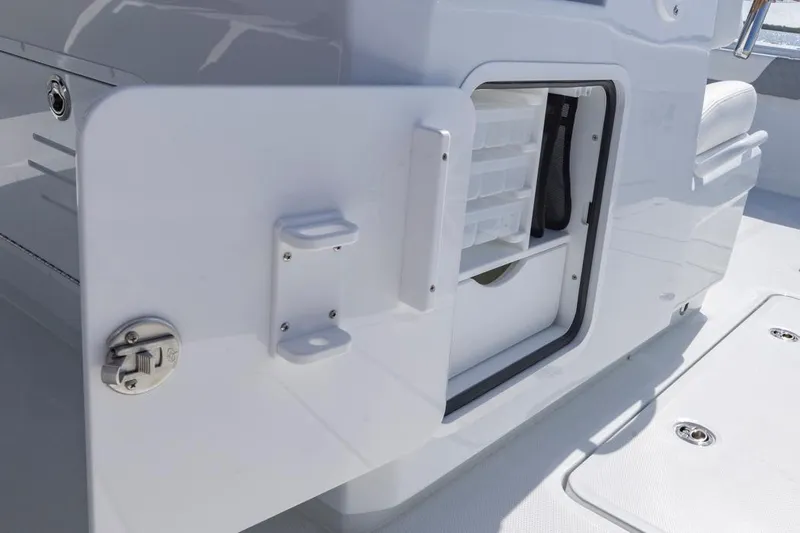  Yacht Photos Pics Open storage compartment on 2026 Invincible 46 Catamaran, showcasing organized interior space.