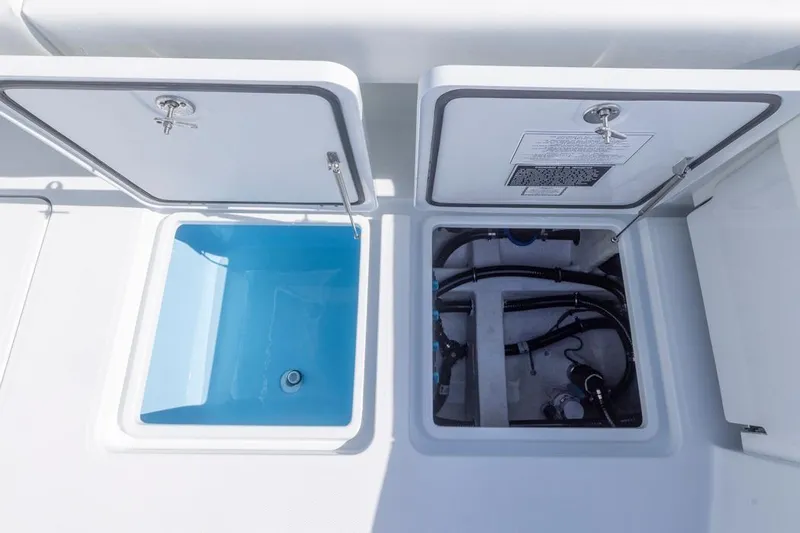  Yacht Photos Pics Open compartments on 2026 Invincible 46 Catamaran, showcasing storage and utility spaces.