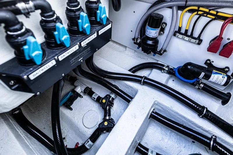  Yacht Photos Pics Engine room of 2026 Invincible 46 Catamaran with wiring and plumbing systems.