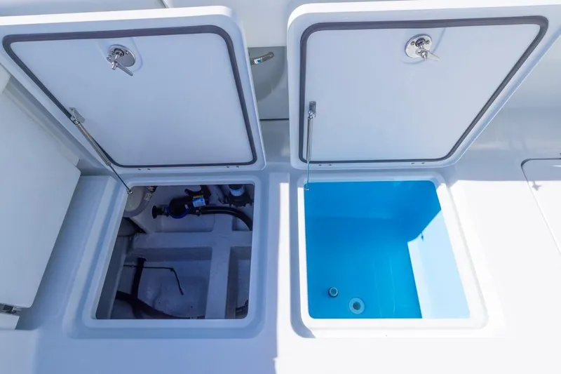 Yacht Photos Pics Open storage compartments on 2026 Invincible 46 Catamaran, showcasing interior design and functionality.