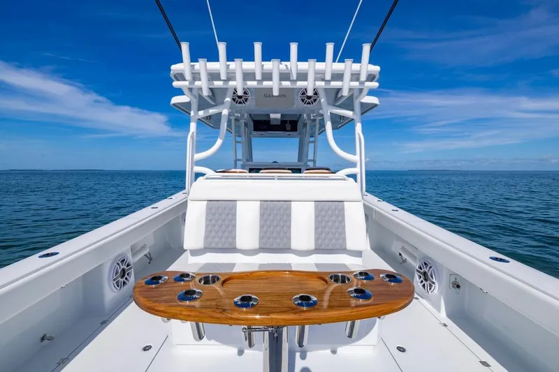  Yacht Photos Pics 2026 Invincible 46 Catamaran on open sea, showcasing sleek design and spacious deck.