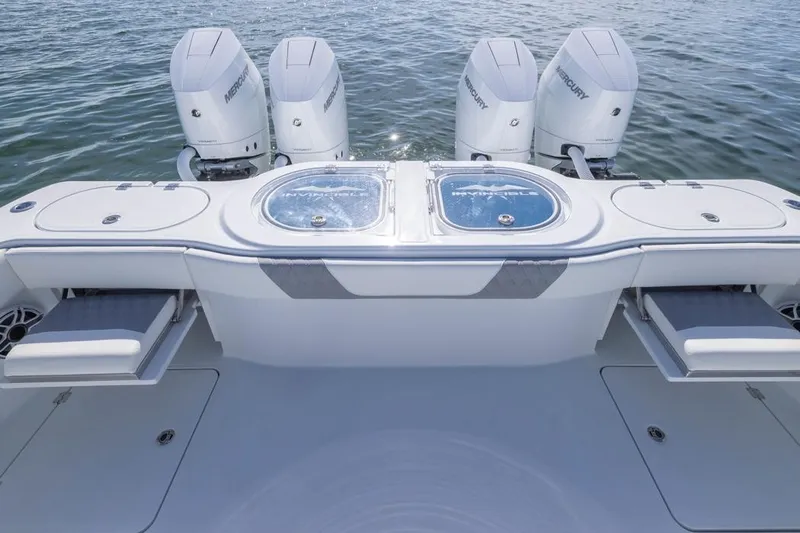  Yacht Photos Pics 2026 Invincible 46 Catamaran with four Mercury outboard engines on the water.