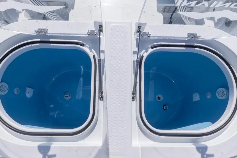  Yacht Photos Pics Twin livewells on 2026 Invincible 46 Catamaran, featuring blue interiors and secure lids.