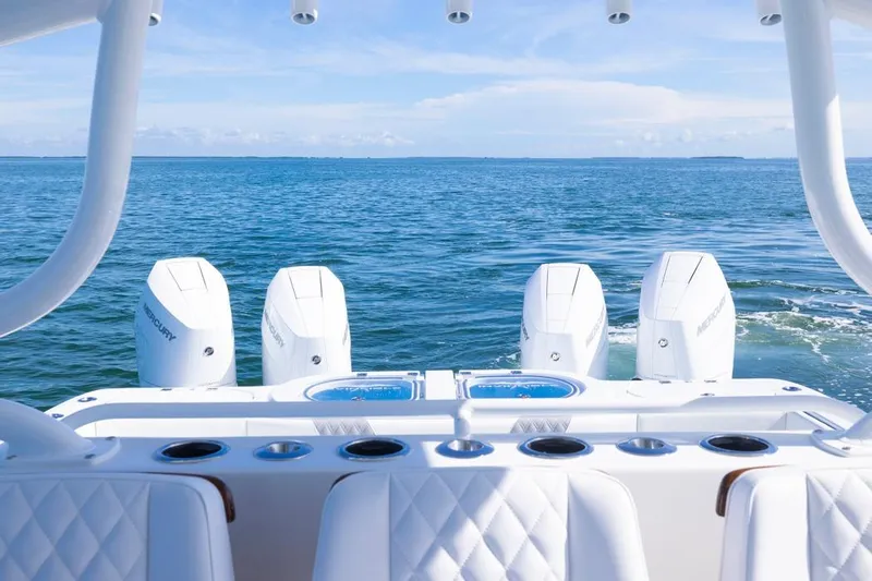  Yacht Photos Pics 2026 Invincible 46 Catamaran with quad engines on open sea.