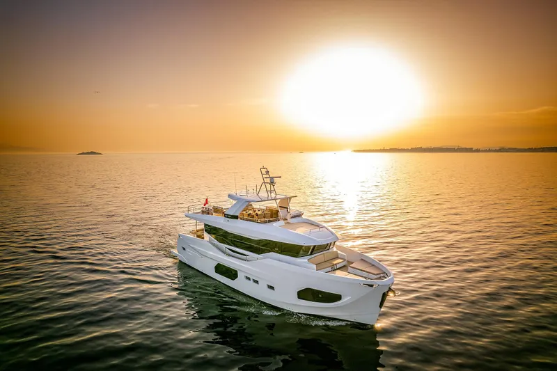 Numarine 22xp Yacht Photos Pics 2025 Numarine 22XP yacht cruising at sunset on calm waters.