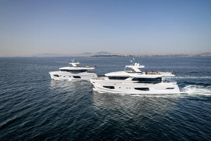 Numarine 22xp Yacht Photos Pics Two 2025 Numarine 22XP yachts cruising on open water under clear skies.