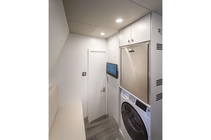 Numarine 22xp Yacht Photos Pics Laundry room in 2025 Numarine 22XP yacht with modern appliances and sleek design.