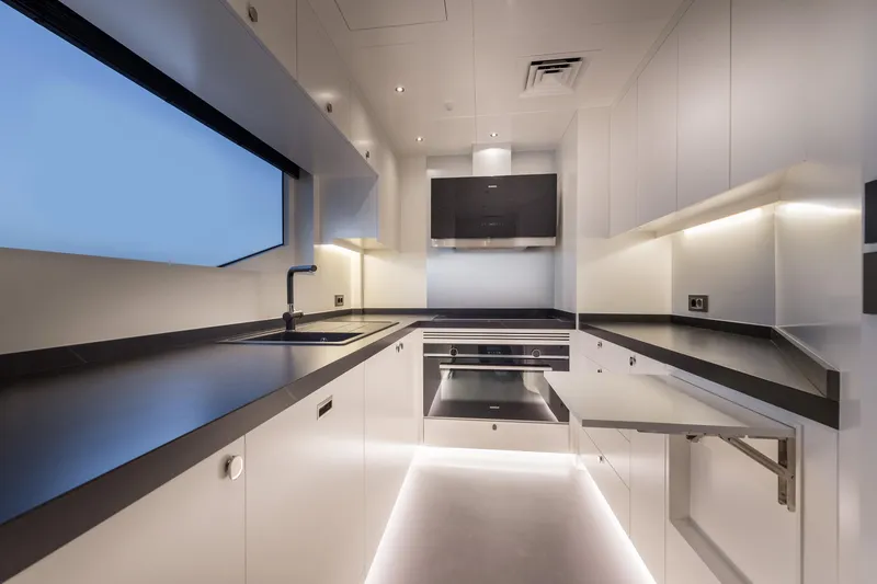 Numarine 22xp Yacht Photos Pics Modern kitchen interior in 2025 Numarine 22xp yacht, featuring sleek design and integrated appliances.