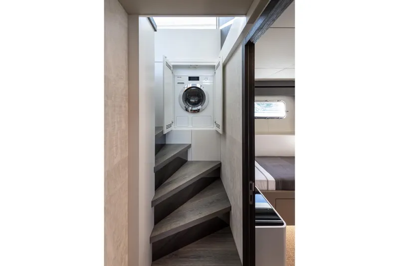 Numarine 22xp Yacht Photos Pics Laundry area on 2025 Numarine 22XP yacht, featuring modern washer and sleek interior design.