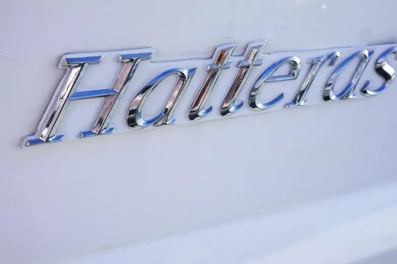 Sunset Grille Yacht Photos Pics Chrome "Hatteras" logo on a 1990 Hatteras 62 Cockpit Motor Yacht.