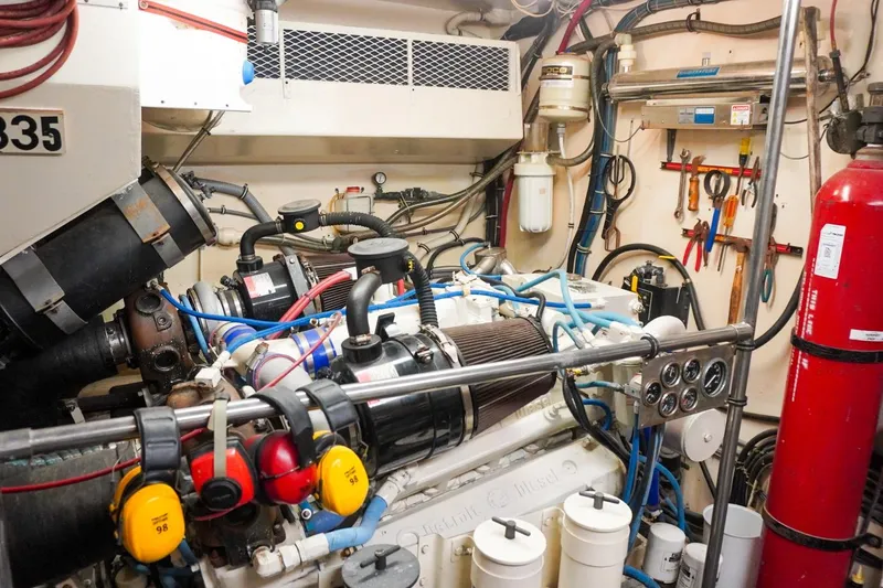 Sunset Grille Yacht Photos Pics Engine room of a 1990 Hatteras 62 Cockpit Motor Yacht with tools and equipment.