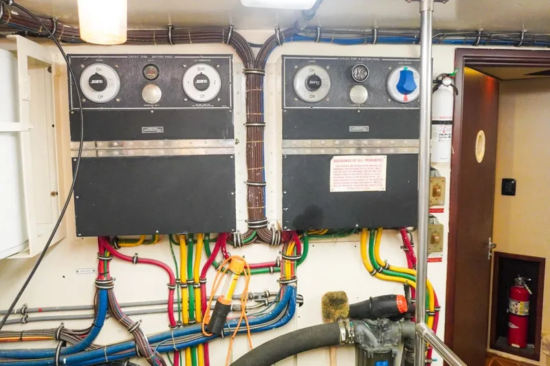 Sunset Grille Yacht Photos Pics Electrical control panels and wiring in a 1990 Hatteras 62 Cockpit Motor Yacht engine room.