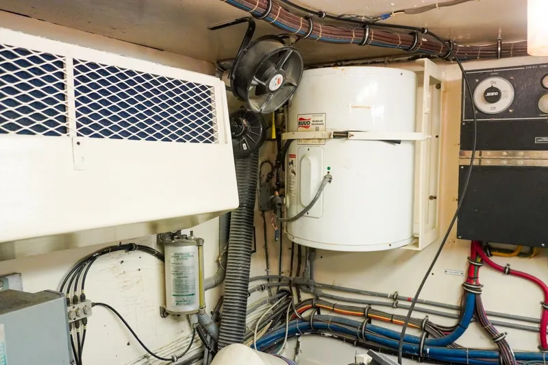 Sunset Grille Yacht Photos Pics Engine room of 1990 Hatteras 62 Cockpit Motor Yacht with wiring and equipment.