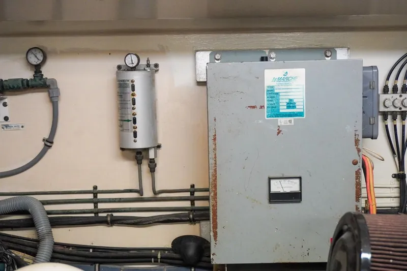 Sunset Grille Yacht Photos Pics Engine room of 1990 Hatteras 62 Cockpit Motor Yacht with control panel and gauges.