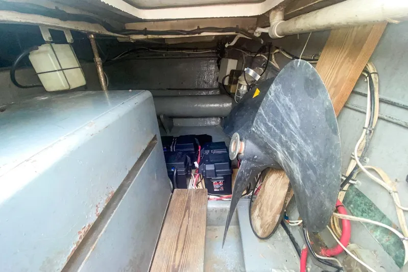 Sunset Grille Yacht Photos Pics Engine room of 1990 Hatteras 62 Cockpit Motor Yacht with batteries and propeller.